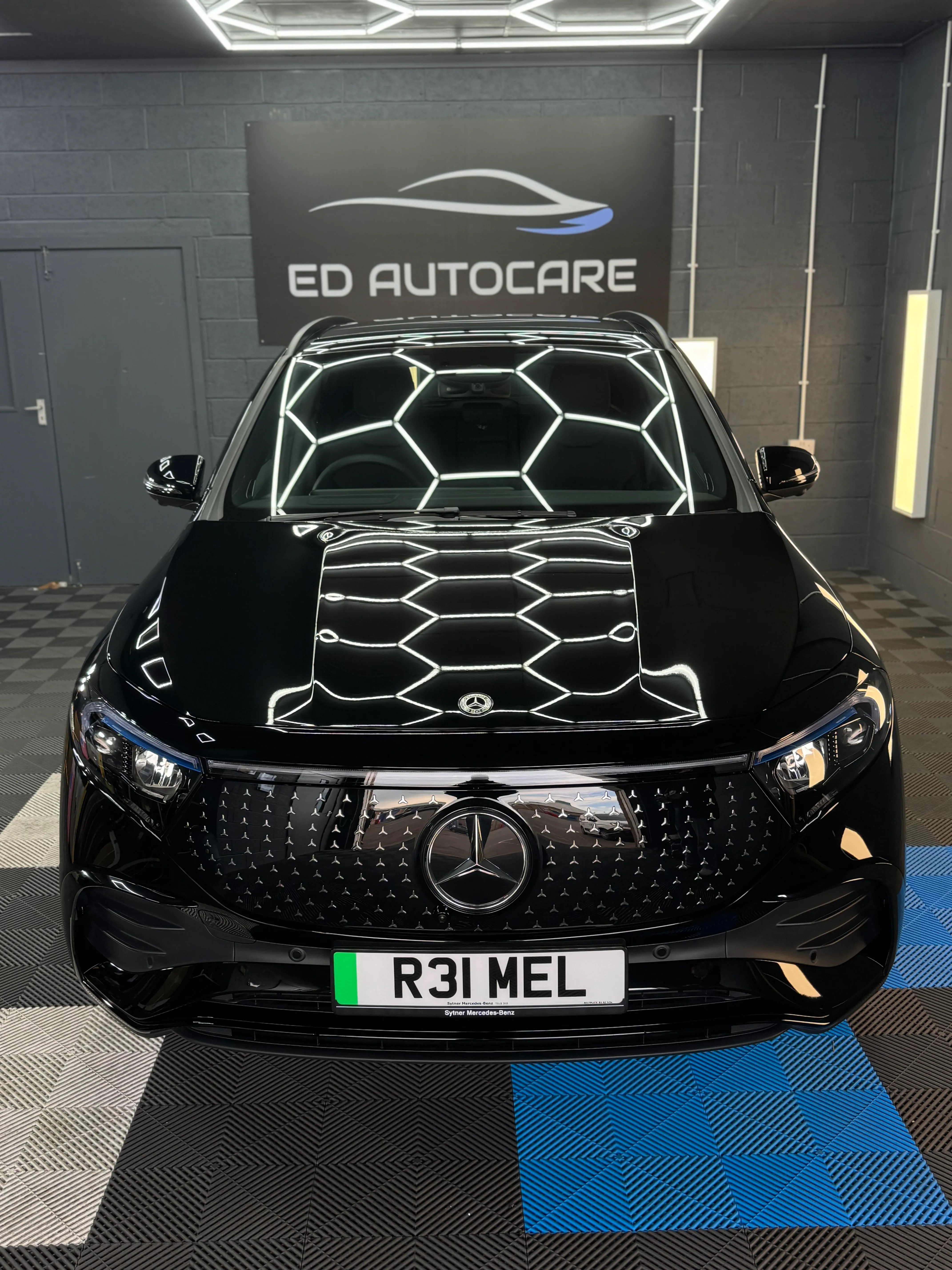 Mercedes with ceramic coating applied under studio lighting